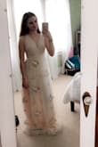 The fit on top is very nice and the adjustable straps are great, saves a lot of money when getting this tailored. The dress is kinda long, and for me personally there is quite a bit of excess material, but that's to be expected. All in all it's a great dress and definitely worth the money. - Olivia C.