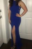 This material is stretchy so that it fitted my curves perfectly and the holes on the side are not too big but aren't way small either. The slit fit a little high but it wasn't a problem for me. It was a little long even with heels on but it was manageable. I love love this blue and the dress itself was super flattering. Would definitely get !! - Taylor N.