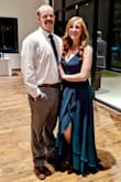 I wore this dress as a guest to a traditional Greek Orthodox wedding and it was stunning! Fit perfectly with a sticky bra, the color was absolutely perfect with my red hair, the strapping was comfortable and the open slit was both sassy and fun. I wore a little gray shawl/wrap to cover my shoulders during the ceremony, which was ideal. Spent the whole night dancing in it! Received so many compliments! - Jenna E.