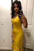 It fits true to size, is made of a very soft cotton material and the frills at the bottom and v neck on top give it a very chic and sexy look. Will go great with sandals or pumps, preferably nude or beige or cream colour. With some mustard tassel earrings. - Sarita U.