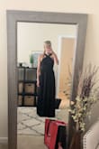 This dress fits true to size. It's super cute and comfortable. I ordered it to wear to a couple of weddings. The top is pretty supportive on its own, so I'm going to try to get away with wearing just petals and no bra. It's slightly too long, but I think it'll be okay with heels. Awesome quality, I would absolutely recommend this dress. - Kristen S.