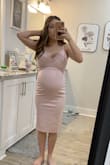 Thinking about wearing this to my up coming baby shower! I'm 31 weeks along and this dress works perfectly! I'm usually a size XS, but went with a Small to support my growing belly lol. Fabric is super stretchy and lots of room! Overall super happy. - Karlie N.
