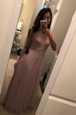 The dress is pretty long. I was wearing 4-inch heels but the dress was still mopping the floor as I walked... and over all it is a little looser than other XS dresses from Lulus. - Candy T.