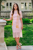 I wore this dress for my graduation photos and really love how it looked! I will say that it didn't fit as snugly as I thought it would, but I didn't mind not having a skin-right dress. The color is absolutely lovely and the lace detailing is stunning! I would definitely consider ordering this in other colors too!! - Emma T.