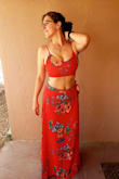 I LOVE this outfit! I feel super sexy in it. The material has no stretch, but still fit comfortably. The top I definitely needed the Large in since I have a big chest, but the bottom I probably could gotten a Medium. Both the top and bottom are very adjustable and you can tighten or loosen as needed. Love love love! - Rachel S.