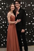 I wore this dress for my school's prom and I got a lot of compliments! I think it's a really lovely dress with good material and a comfortable feel, I ordered an extra small since reviews seemed to say it runs a little large so the xs choice was great!! The material on top was a little different than I thought so if you have a small chest when you lean forward you might risk being exposed but tightening the straps and just staying a bit conscious and you're all good, it's also a pretty long dress so you'll either want tall heels or to get it shortened depending on your height! - Kaley T.