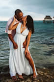 This dress was amazing! I had the straps taken in and had it hemmed. The fabric was lightweight and perfect for my wedding on the beach. - Tara W.