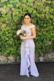 I loved my dress. I was a bridesmaid and we were all wearing dresses in the color Iris from David's Bridal, but I did not like the dresses from there. I found this one and another bridesmaid got another lavender dress from this site and the color was perfect! I did have to hem it since I'm just 5'2, but other than that it fits true to size. I loved it and got many compliments. My hips looked great in it, and I just had a baby 3 months ago. It made me look good, and I felt sexy! - Gabriela V.