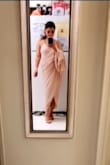 I wore this dress for a wedding, and I absolutely love this wrap dress. I got soo many compliments. When I walk in this dress it trails behind me, and I felt like a goodness. When walking it tight places I had to carry my dress over my arm and it looks so amazing. When dancing and catching the bouquet - I put the tail of my dress in/over the belt. It was prefect. On the model it looks like a nude color but it is a gorgeous blush, slightly pale pink. I purposely went a size up (size L) because I wanted more coverage (wrapping) on the top, and I wanted the train to be longer. I'm so happy that I've made that decision. - Serena L.