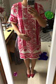 I ordered this dress because I felt like it could be dressed up / dressed down for multiple occasions. I read the description knowing it was "relaxed fit". But I wasn't aware that relaxed fit meant grandma-no-shape fit. The model's photos are really misleading. If I pose like the model, I suppose some type of figure comes through. It's just definitely not flattering at any angle. I'm really disappointed because I think the pattern and color are to die for! I will be returning. I wouldn't say that the size was wrong, though. It fit really well in the arm, so if I went to an XS then I wouldn't be able to get in or out of the dress. There's no zipper that I could find, so it goes right over head. Have to find a new dress to wear to my college formal. - Elizabeth P.