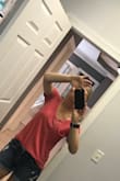 I have this in 5 or 6 colors now. Seriously. Every time I order from Lulus I add in one of these because I wear them constantly! They do run a little large and I could probably do the XS, but I'm afraid to change it up because I like the way the small fits one me. I like my tees a little loose.  If you like more form fitting tees, go a little smaller. If not, go true to size.  Just order multiple colors because you will want more! (Pic is the pink version.) - Kasi H.