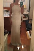 I like my dresses fitting rather snug, and XS usually fits me perfectly and exactly as I like. However, this one is slightly too tight. It will do. I love the lace, the sash around the midsection, the fact that it's cream, and the scalloped top. The only other issue I have with this is that I am a 32D, and the top doesn't cover me completely. The fabric pulls, so I took it to a tailor to have her add fabric.
I'm wearing this for my court wedding and will be a little on the fancier side, but I will be so happy to wear it. :) - Courtney R.