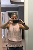 This fits a tiny bit big, but the next size down would be too small I think.  Plus, the way it puffs out is the style. I'm okay with it being a little baggy.  The waist in the middle still shows your curves just fine. I also love the color! - Kasi H.