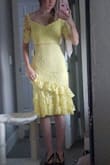 Really beautiful dress. Bought to wear to a wedding in June, but I think it's just a little too fancy for this particular wedding. I love the top (from hips up) of the dress so much. It's really flattering even though I have a very small bust. Bottom half (waist down) just was too busy for me. Too many ruffles kinda looked like I was going salsa dancing. I was surprised the bright yellow didn't look glaring against my pale skin tone and actually looked nice for spring. It fit like a glove, but there's no stretch, and I was worried I wouldn't be comfortable sitting down. You can't raise your arms above bust height due to the sleeve style. 5 stars because it looks as pictured and was really beautiful for the price. Just wasn't perfect for me. - Stephanie M.