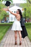 This dress fits true to size! The material is a high quality, heavy material. The material is breathable, so perfect for outside events like graduation! I highly recommend this dress to anyone looking for a dress to a nice event like graduation! - Jordan B.