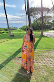 Just bought and wore this dress to a wedding in Maui, Hawaii.

Unfortunately, this dress was a bit long for my 5"1' height but did not have time to hem so I wore platform heels.

I wish I got an XL rather than an L since it was quite busty.

The color and the design with the slit was super flattering and I received a lot of compliments. I loved the orange mango color. Super flattering with my skin tone and outside my comfort zone of darker colors. The dress is also super photogenic :D - Monica S.