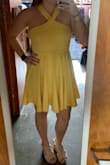 You can't really tell from the picture but the yellow is a gorgeous color. I bought this for a wedding coming up in June and I can't wait to wear it! Dress is a thick material but doesn't feel heavy when wearing it, and haven't had a problem with wrinkles! - Maegan W.