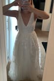 The dress is beautiful but the fit is off. It looks very nice and fitted on the model but it is not right in person. The ribbon at the waistisn't straight and it makes you look kind of wide. - Stephanie B.