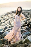 I wore the dress for my maternity announcement shoot, and it looked great!
A bit deeper neck than I would have liked even after setting the straps, but other than that the dress falls very nicely on the curves and blew a little in the wind that made for nicer pictures. :) - Winnie N.