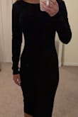 LOVE this dress!! Conservative, but sexy and fairly high quality. The back actually has some boning to help keep its shape. I wore this to a wedding and received many compliments along with one nasty comment from a woman who thought the slit in the back was too high. Majority rules, right? - Amy S.
