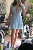 I love this dress! Completely true to size (the size chart places my measurements as Small and Small is what I ordered). It's completely lined so its not see-through and you don't need a bra. The fabric is looks and feels much nicer than it does online, it's very soft and floaty. There is no stretch. The tie-back makes the waist adjustable. I love all three colors, but I don't have any other blue dresses so I got this one. - Phoebe M.