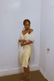 I loved the dress! I brought the red in a medium and this in a small. This one fit better, and I love how the strap is adjustable. It's flowy but doesn't have stretch which allows for the dress hug your curves. - Chia M.