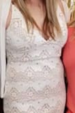 This dress was slimming and felt good; however, my chest was pouring out and made it feel uncomfortable while wearing it. Wouldn't recommend if you are modest/ don't want your girls hanging out. Had to wear the sticker bra because of how low the cut was. You cannot wear a normal bra. - Michelle R.