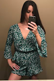 I bought this romper on a whim and I'm glad that I did. The color is beautiful and I love the ruffles.the only issue I have is that there is more material than I would in the middle where it ties. - Shana B.