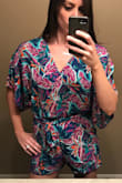 I sized up to a M in this romper based on the reviews mostly due to the length. The material is lightweight and flowy. A must have for summertime! - Shana B.