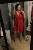 I was skeptical to order a smaller size as a lot of the reviews suggested. I am normally a large in Lulus dresses specifically and spoke to a fit expert and they said a large for me for other dresses based on my measurements. BUT I ordered a size down and could not be happier! It fits like a glove. 
The material is high quality and a stretchy fabric. 
It is also a nice length, not too long and not too short. 
It is also roomie for busty girls! - Rachael L.