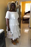 I love everything about this dress. It's not a bright white, but more of a shell white. It's sexy but conservative. Can be wore to varying occasions, dressed up or down. The material flows nicely. - Shawnette L.