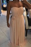 The fit is true to its size. I am 5 feet therefore I knew it was going to be long on me but other than that I love the dress! The color is beautiful! - Mari B.