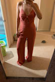 I ordered this jumpsuit for an event this weekend and am in loveeee with the color. This is perfect for any brunch/day events for the summer time and fits true to size. Can also pair it with a leather jacket for the night as well for a chic look. I wish there were more colors for this because love the back and front knot details! - Michelle C.