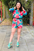 This romper's a summertime cutie! I love the open back detail and I've always been a fan of long-sleeved rompers! The red/green florals make a bold summer statement and is perfect for a tropical getaway! - Jennifer S.