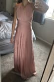 Beautiful dress and love the many ways to style. Does show everything underneath due to type of fabric (hip bones, belly button) not see-through, just tight. If you can wear spanx it should take care of that issue. Was worried that my measurements were under the Xs size description and it wouldn't fit, however it fits great and is actually a bit harder to get around my hips than I would've thought. Will have to have it shortened a little. - Sheena D.