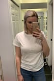 A little smaller than expected but I wouldn't size down. It's actually a flattering and slimming little tee! Love it. Might have to get more colors - Caitlin G.