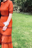I'm 5'4 and 125 lbs and a size small fit perfectly! I thought it was going to be too snug but it hit in all the right places! I would recommend this dress to anyone and everyone! The orange was especially beautiful because I wanted to stand out, but not be too dramatic. It's the perfect mix between unique and elegant! - Louisa D.