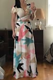 I bought this for my honeymoon and wanted something light and fun for Barbados. This dress is adorable, but it is a tad loose at the waist on me. I wore it recently with a Lulus black backless bodysuit and a belt, that helped a lot with that! If the elastic at the back was a little tighter, it would be absolutely perfect. Also, just FYI, if you're short like me you will definitely need to wear heels or have it hemmed. I wear heels with everything so it's perfect! :) - Alli G.