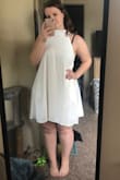 Usually I wear a large in dresses but after reading the reviews, I decided to order a large and medium to try on. The medium fit perfectly! The dress was a good length (I was worried about this because I have bigger thighs). It was a good material and very flowy and comfy! - Heather O.