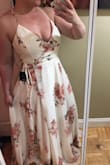 I bought this dress for my engagement photos- and I absolutely love it. I originally ordered a medium but it was too tight on the bust. I returned it for a large and the fit was perfect. I'm 5'5 and it's a little long but it looks like with heels it shouldn't be a problem. The material is great quality and I'm very pleased with my purchase! - Taryn K.