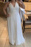 Love this dress! The neckline is not too low and it fits beautifully. It is pretty long and I had to have it hemmed. - Nicole L.