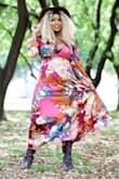 I bought this dress for a birthday shoot. It runs small as the site mentions but I found it easy to adjust and loosen with the tie strings attached. It's very light weight but not at all see through. Perfect material to breath in for hot days. And for a long sleeve dress I was impressed with how it kept cool. Also, the colorful pattern has this duality of looking super luxe but boho at the same time. Total head-turner! - Starisha S.