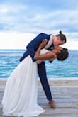 I'm getting married at the beach in the Dominican Republic and I was looking for a fresh, yet elegant dress for my wedding; and I'm so happy I found this one. It was hard to get but I'm obsessed with it. I usually order a size 4 but I'm glad I followed the other buyer's advice and sized down. The material at the bottom is so thick so it's not see through, and the top part is totally speechless. I couldn't be any happier about my purchase.
UPDATE: I got married last month and I loved my dress. People could not believe that I didn't get it from a bridal boutique. I took it to the tailor and trimmed the bottom front so that I could walk and dance with it, which made the train look longer. Now, it is important to highlight two things. First, don't wear white underwear with it and second, the dress is not completely white. - Jazmin R.
