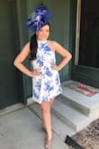 Runs large. I followed the other reviews and ordered one size down and I'm glad that I did. The small fit perfect! Ordered for a Kentucky Derby themed baby shower and received many compliments! - Jennifer T.