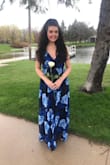Love this maxi dress! Runs a little large but not enough to send back. The straps help to tighten around chest area. Love the back of the dress and how flowy the fabric is! Wore on 21st birthday for pictures and am going to wear for a wedding in July. Beautiful vibrant blue roses! Would definitely recommend! - Jennifer T.
