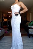 Absolutely loved this dress! Stunning, flattering, and excellent quality with a little bit of stretch for moving and dancing. Runs a little big particularly at the bust (at least for me) but could easily be taken in. Purchased a small (5'4", 130 lbs, athletic build). - Samantha B.
