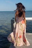 I wore this to a beach wedding. I don't think I've ever received so many compliments! It was absolutely gorgeous! It is a little long, even with some nice heels, but I think that is part of the look. - Kim C.