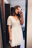 I bought this dress for my college graduation coming up, and when I first tried it on I loved it! It's a tiny bit loose in the chest for me, but nothing too noticeable. I might use some dress tape to keep it in place. This is the perfect white dress for any occasion- graduation, bridal showers, etc. Will definitely be using Lulus more often. - Alexis K.