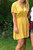 This dress was adorable for an event I had. I am normally a size 14 and likely could have worn a L due to forgiving wrap style - Alyssa D.