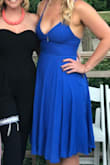 This dress is AWESOME. Will be wearing it to a wedding this summer. The front is just low-cut enough. The back has adjustable ties to give you the - *ahem* - right lift in the front if needed. The color is a little more royal blue in real life than in the picture - but I actually prefer it that way anyway. - Alyssa D.